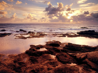 Rocky beach water clouds foreground - a rocky beach free wallpaper for desktop