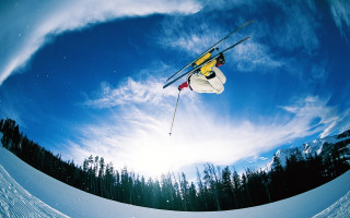Skier midair jump snow trees - fisheye len free wallpaper