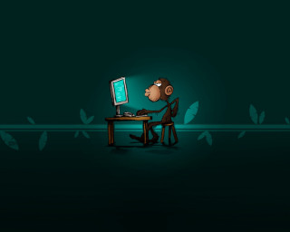 Cartoon monkey sitting desk computer - a desk free wallpaper