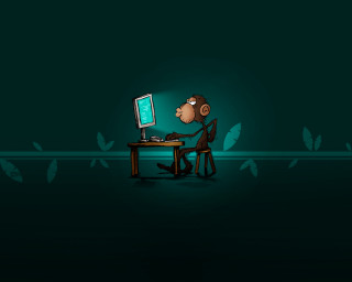 Cartoon monkey sitting desk computer 3 - a desk free wallpaper