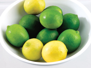 Bowl lemons limes white tablecloth - a still life free wallpaper for desktop