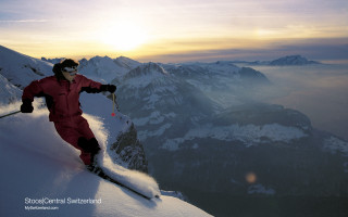Man red snow suit skiing 2 - a mountain side free wallpaper