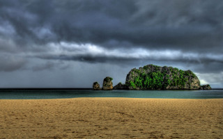 Beach rock formation cloudy sky 7 - stormy weather free wallpaper