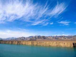 Lake mountains blue sky clouds 4 - a few boat free wallpaper