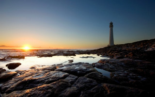 Lighthouse rocky shore sunset sun 2 - the rock free wallpaper