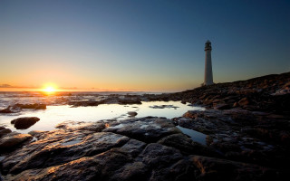 Lighthouse rocky shore sunset sun 4 - the rock free wallpaper