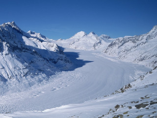 Skier snowy mountain slope view 2 - ice free wallpaper