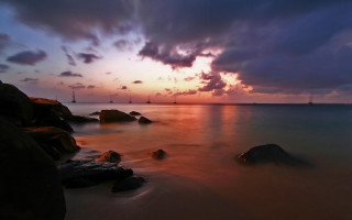 Sunset water rocks lighthouse cloudy 4 - dave allsop free wallpaper
