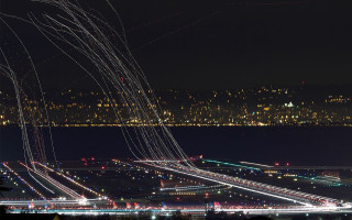 Night city lights airplanes flying - long exposure free wallpaper for desktop