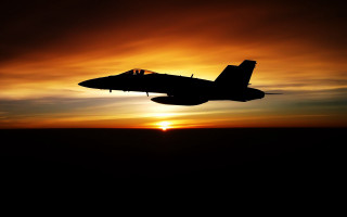 Fighter jet sunset cloudy sky - the sun setting behind free wallpaper