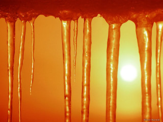 Icicles sun orange background hues - melting free wallpaper