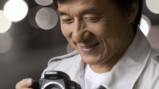 Man holding camera smiling blurry - canon free wallpaper