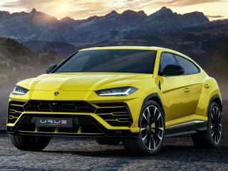 Yellow lamb urus suv mountain - the sun setting behind free wallpaper for desktop