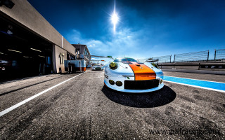 White orange sports car parking - wide angle len free wallpaper