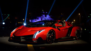 Red sports car night parking 5 - a castle in the background free wallpaper for desktop