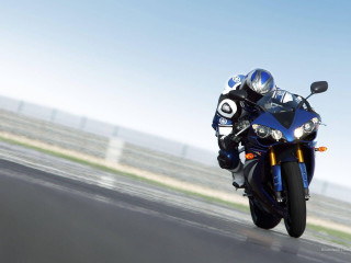 Motorcycle rider track sky fence - motion blur free wallpaper