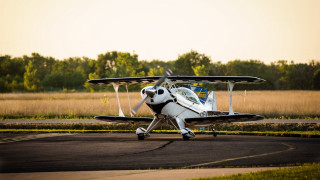 Small plane parked runway grass - a small plane free wallpaper