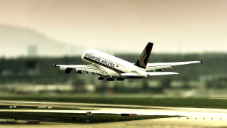 Large passenger jet flying runway - foto realistic free wallpaper
