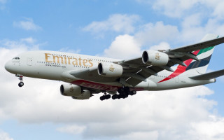Jetliner emirates cloudy sky landing - a cloudy blue sky free wallpaper