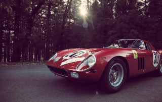 Red sports car forest city - tall tree free wallpaper