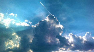 Plane flying cloudy sky jet 2 - a cloudy blue sky free wallpaper