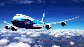 Jetliner flying blue sky above - free airplane wallpaper