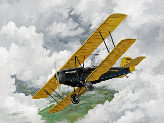 Yellow black biplane flying clouds - a propeller free wallpaper