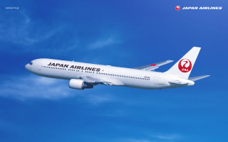 Japan airlines jet flying blue - a blue sky background free wallpaper for desktop