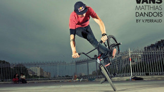 Man riding bike cement ground 2 - a fence and a fenced in area free wallpaper