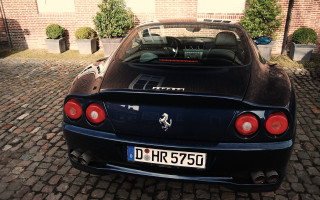 Black sports car brick building 2 - a brick road next free wallpaper