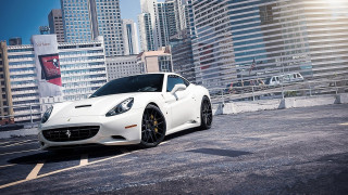 White sports car cityscape fence - a parking lot in front free wallpaper