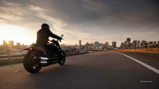 Man motorcycle city skyline sunset - the sun setting free wallpaper