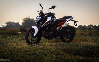 Motorcycle parked field grass trees - a field of grass free wallpaper