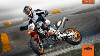Person riding motorcycle track helmet - action pose free wallpaper