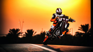 Motorcycle ride sunset orange sky - a person riding free wallpaper